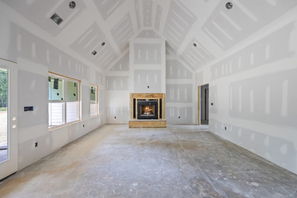 Bright, open-concept living room with vaulted ceilings in a newly constructed home in Northeast Georgia.