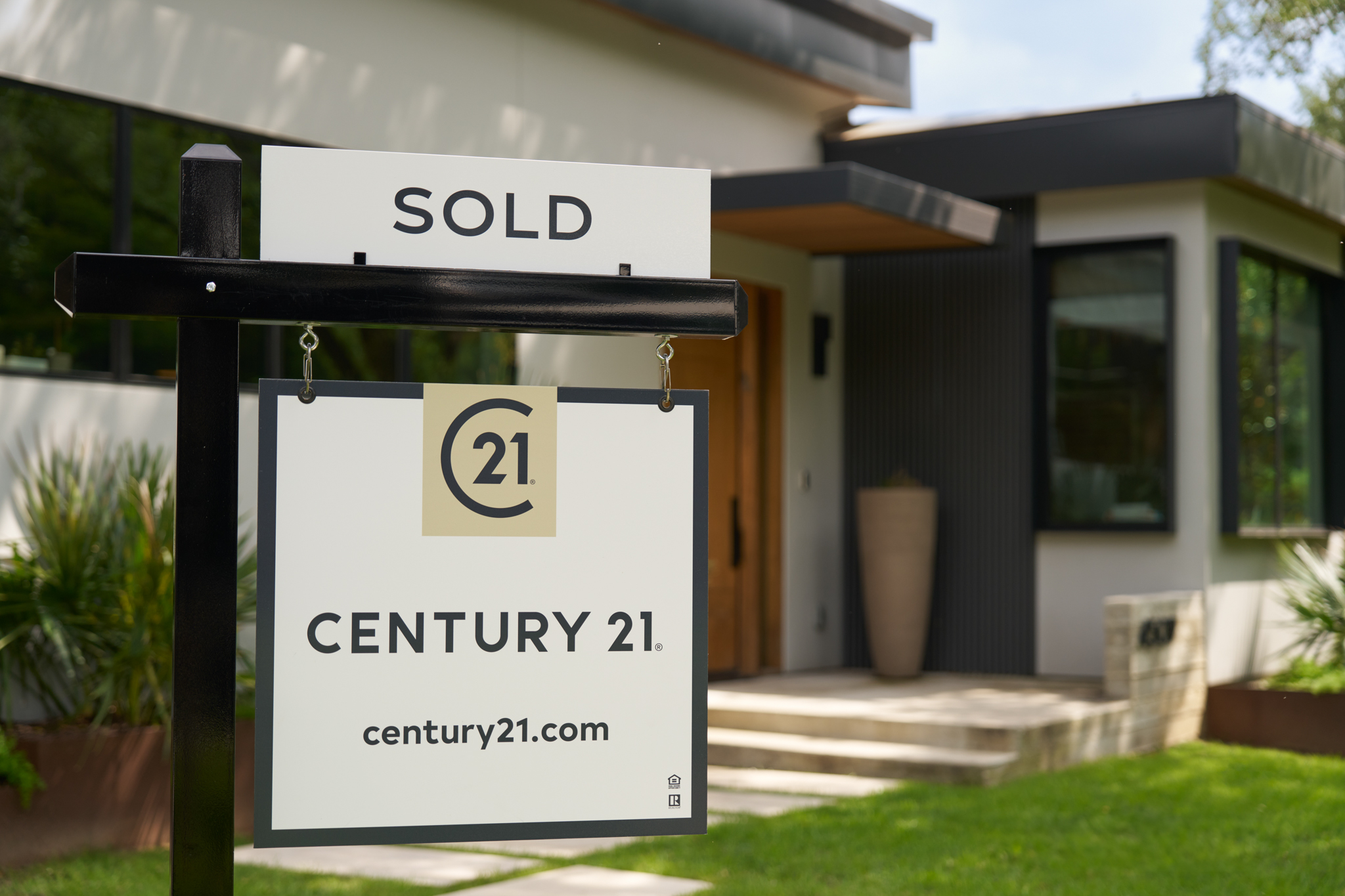 Century 21 sold sign in front of a modern home in Northeast Georgia