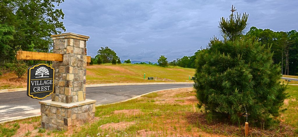 Stone entrance sign for Village Crest, a new 58-homesite residential community in Clarkesville, GA